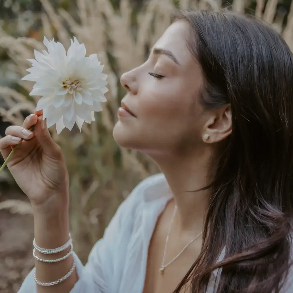 Bride wearing pink tourmaline earrings by CITRUS