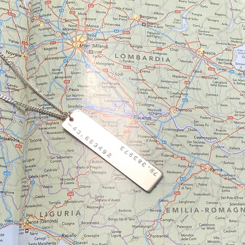 silver necklace stamped with GPS coordinates
