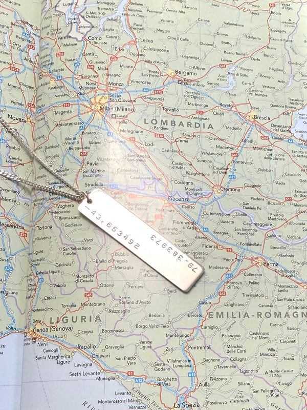 silver necklace stamped with GPS coordinates