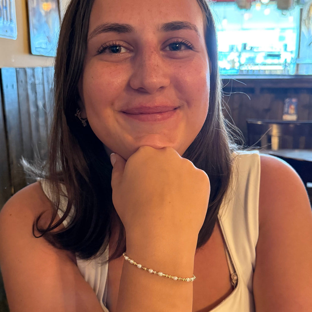 Woman sitting at a table in a restaurant with a blurred background