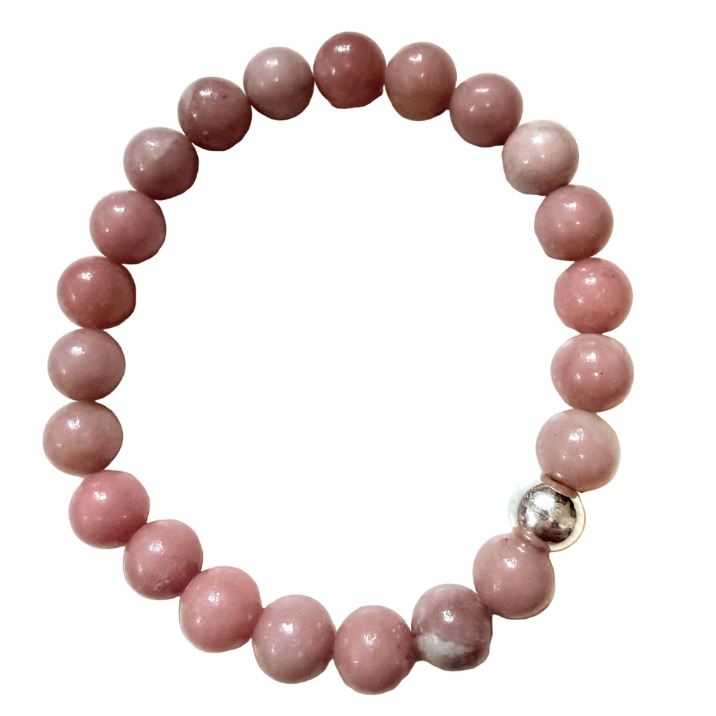 Pink beaded bracelet with a silver clasp on a white background