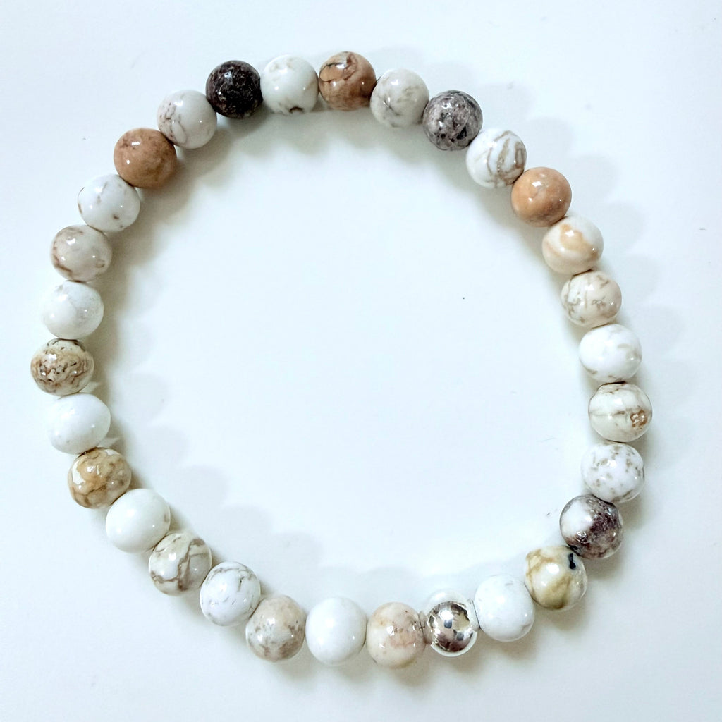 Beaded bracelet with multicolored beads on a white background