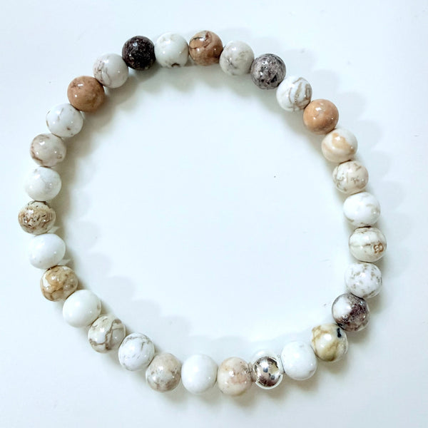 Beaded bracelet with multicolored beads on a white background