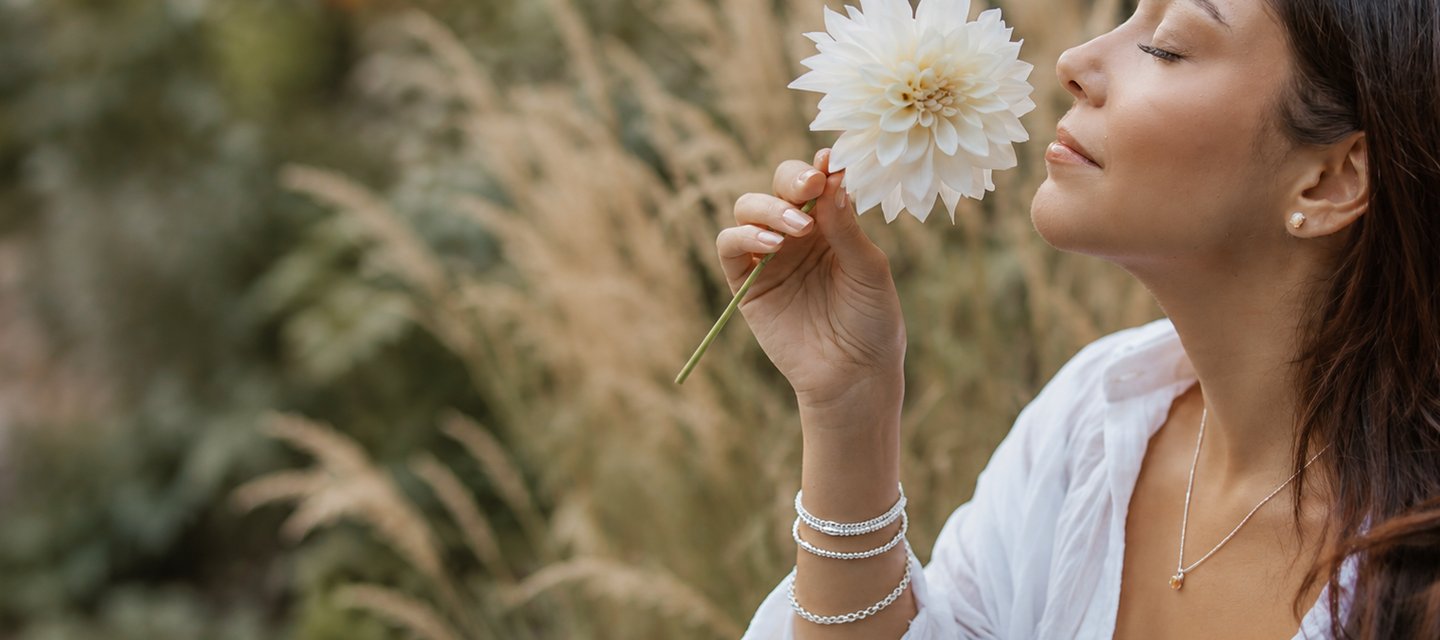 Woman wearing silver beaded bracelets by CITRUS